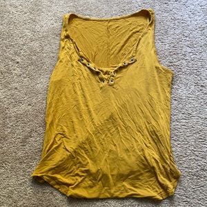 Mustard yellow low cut tank.